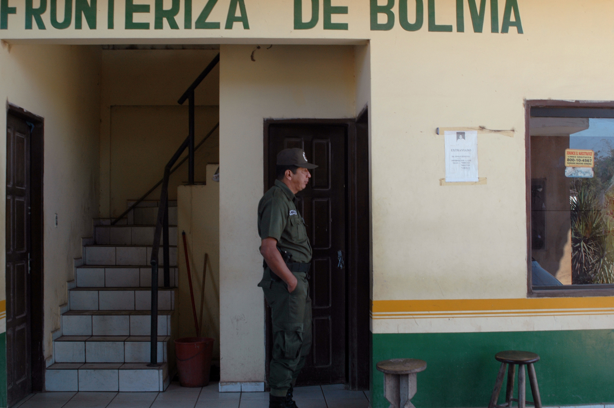 A color photograph of a security guard patrolling the fronteriza de Bolivia.